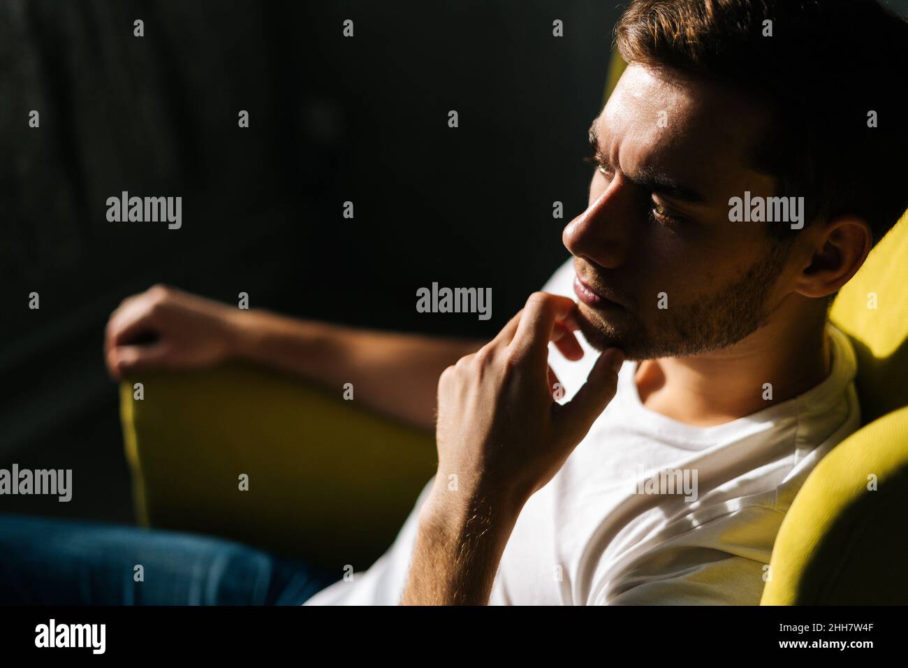 Thinking touching chin stroking hi-res stock photography and images - Alamy