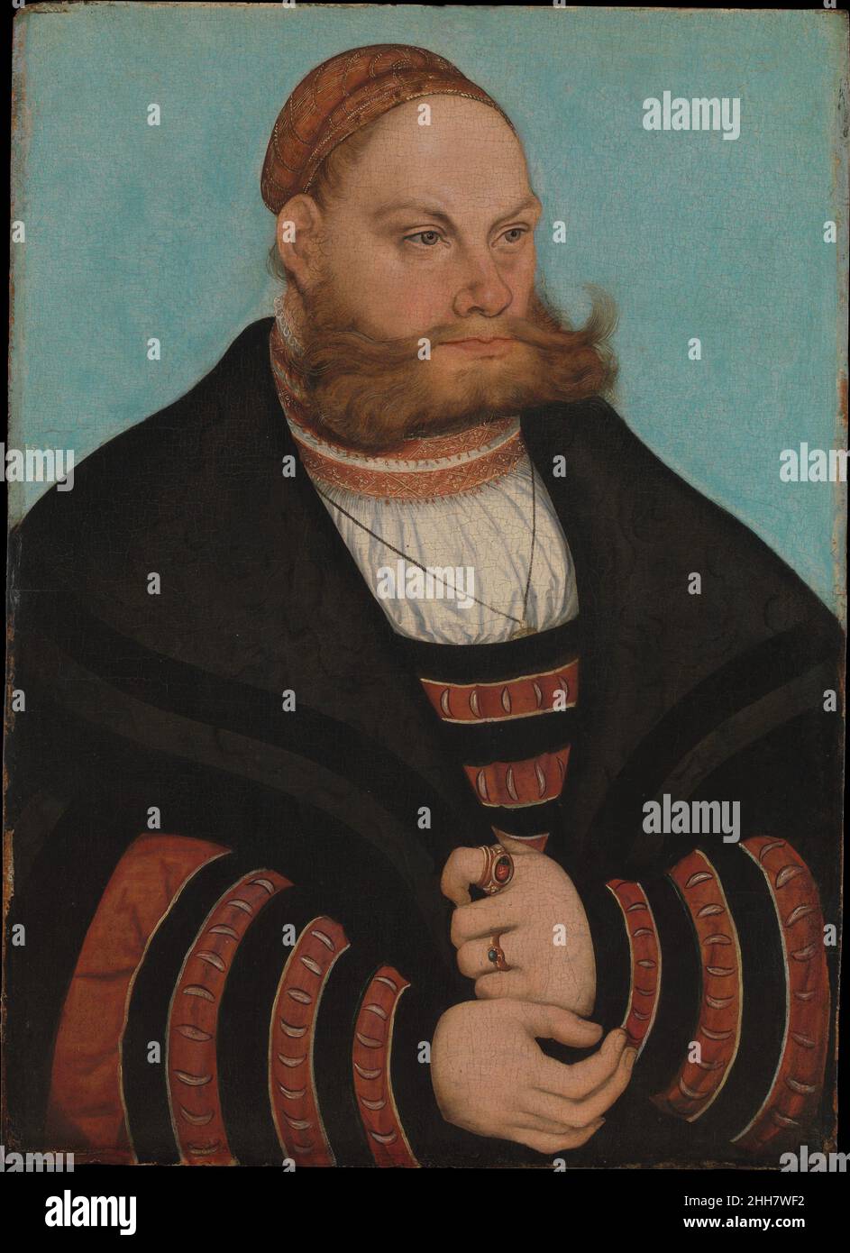 Lukas Spielhausen 1532 Lucas Cranach the Elder German The sitter, who wears the black-and-yellow striped dress of high-ranking members of the electoral court of Saxony, may be identified by the initials LS on the signet ring as Lukas Spielhausen, who was by 1531 a lawyer in the state judicial curia under Johann I, the Constant. His age of approximately thirty-nine in 1532, the date of the painting, is compatible with the sitter’s appearance. The lively pattern of colors and interplay of curves in the costume and the contrast between the man’s tightly bundled hair and expansively projecting mus Stock Photo