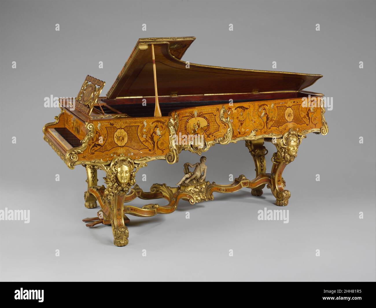 Grand Pianoforte ca. 1840 Érard This piano, featuring an extraordinary marquetry satinwood case designed by George Henry Blake, is one of the most elaborately decorated instruments of the nineteenth century. It was commissioned from the London branch of the distinguished French firm of Érard by Thomas Henry Foley, Baron of Kidderminster, for Witley Court, his residence near Herefordshire and Worcestershire. The decorative program of the piano consists of mythological personages, references to the Foley family, and symols related to music-making and musical instruments. The piano case features Stock Photo