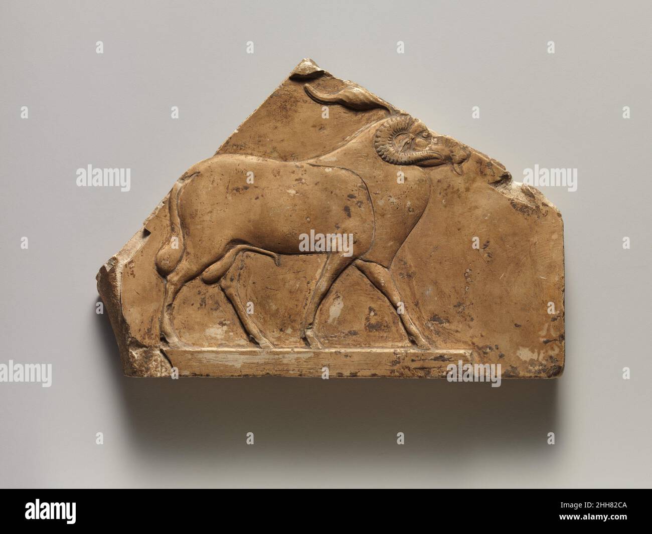 Relief plaque with ram, and on opposite side two feet 40030 B.C. Late