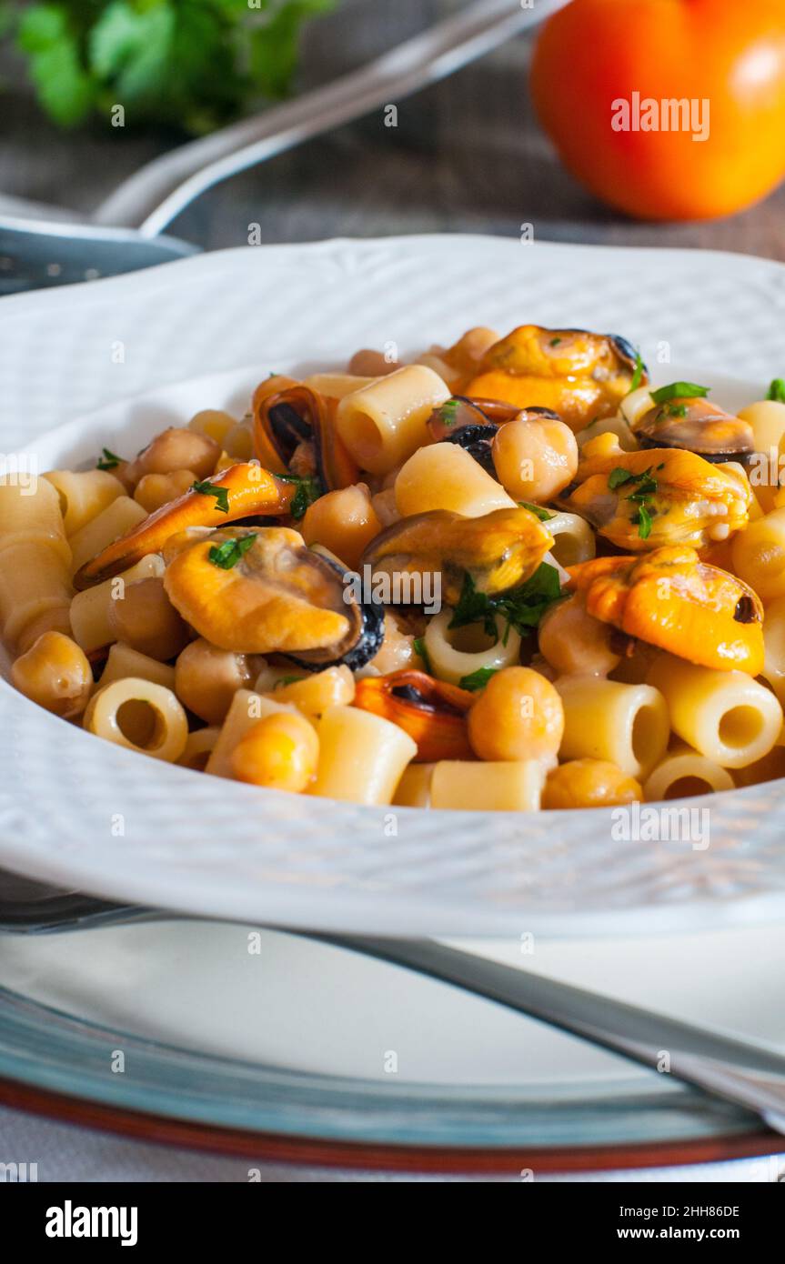 Italian pasta with chickpeas and mussels Stock Photo