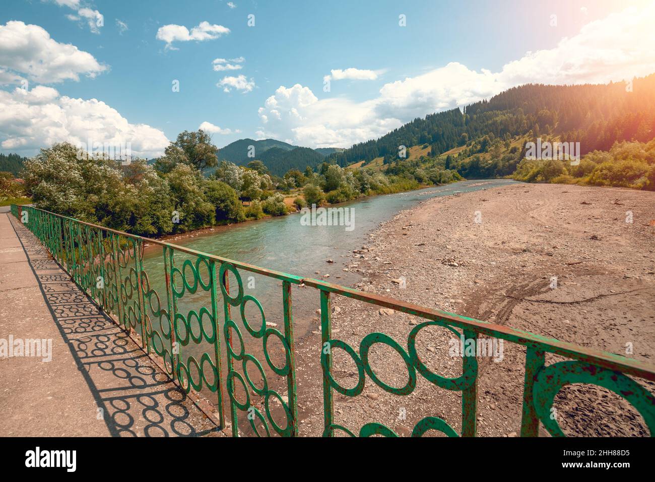 Beautiful summer landscape with mountain river on a sunny day. Bridge over the Black Cheremosh river, Ukraine,  Europe Stock Photo