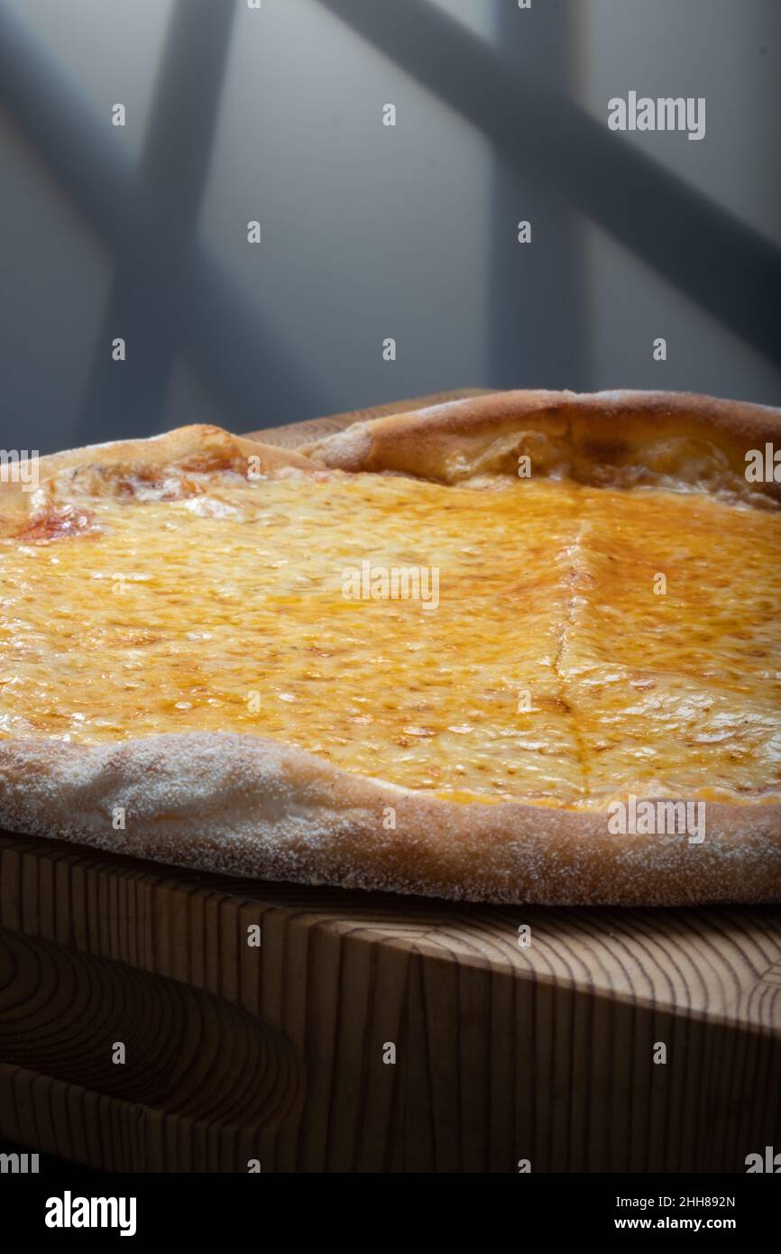 Helsinki / Finland - JANUARY 22, 2022: Closeup of homemade New York style Margherita cheese pizza. Stock Photo