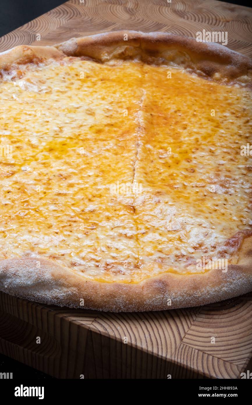 Helsinki / Finland - JANUARY 22, 2022: Closeup of homemade New York style Margherita cheese pizza. Stock Photo