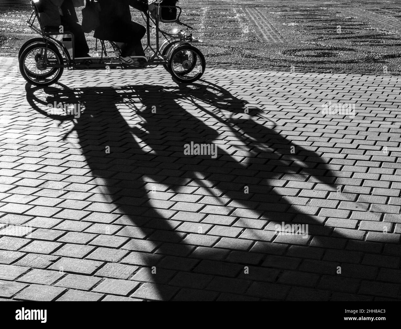 Quadricycle riding in the Plaza de España in Seville. Stock Photo