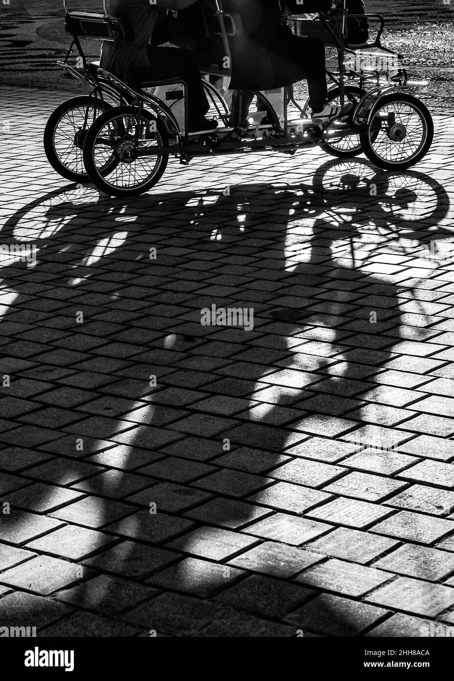 Quadricycle riding in the Plaza de España in Seville. Stock Photo