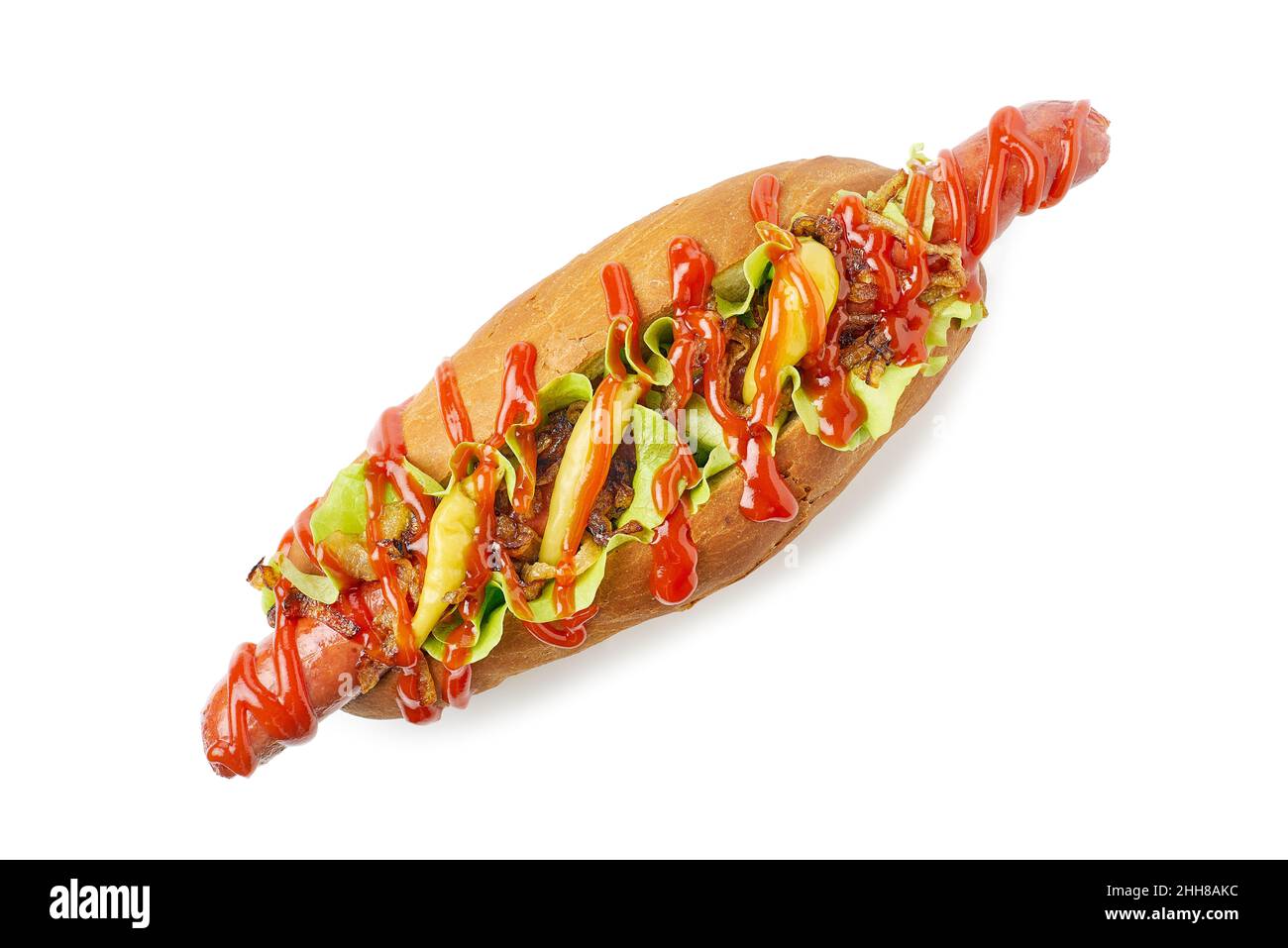 Yummy hotdog with fried onion and pickled peppers on white Stock Photo