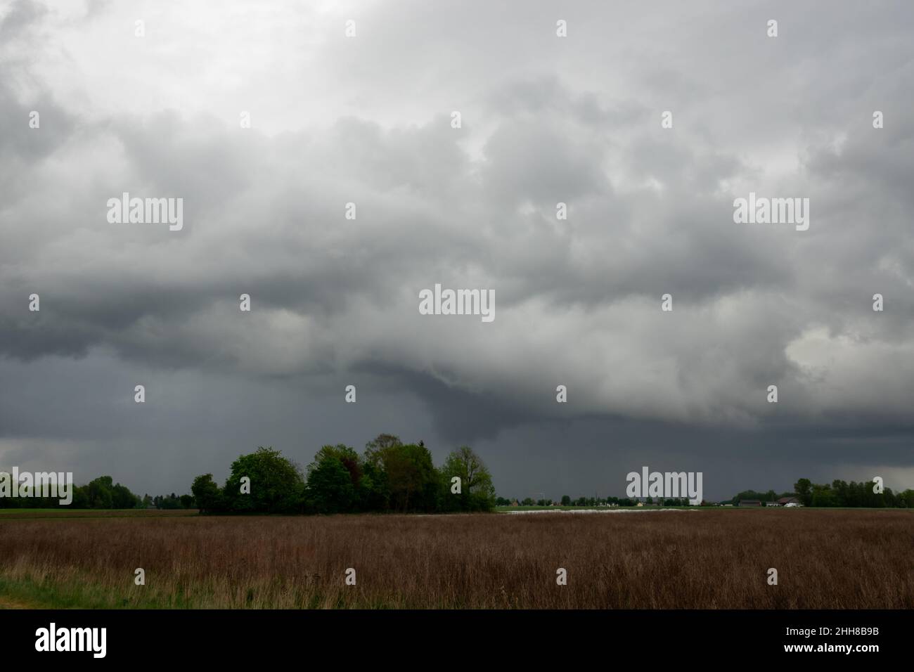 Stormy Clouds Over Farm Field Stock Photo - Alamy