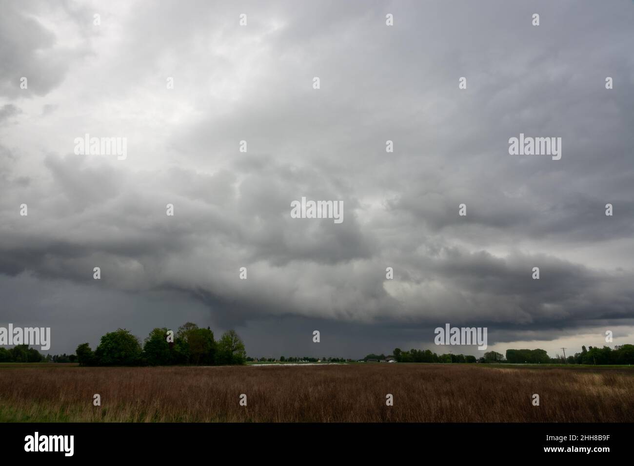 Stormy Clouds Over Farm Field Stock Photo - Alamy