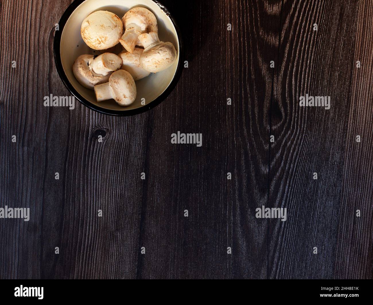 bowl with mushrooms on wooden top and space for writing Stock Photo