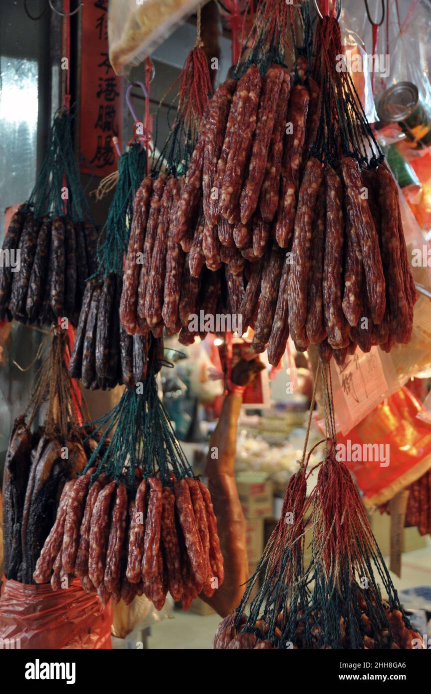 Preserved Cantonese sausages hanging on display in Tai Po Market 大埔, Hong Kong, China. Stock Photo