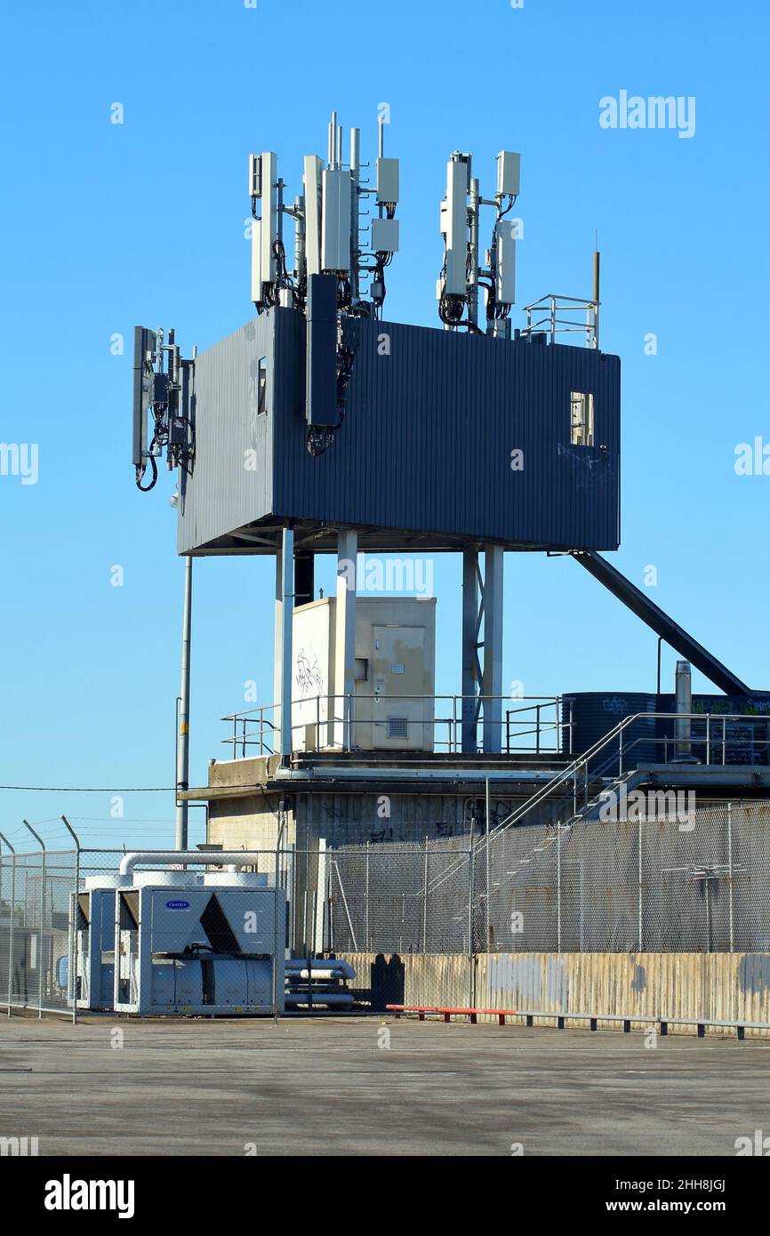 Mobile Phone base station with cluster of cellular repeaters, situated