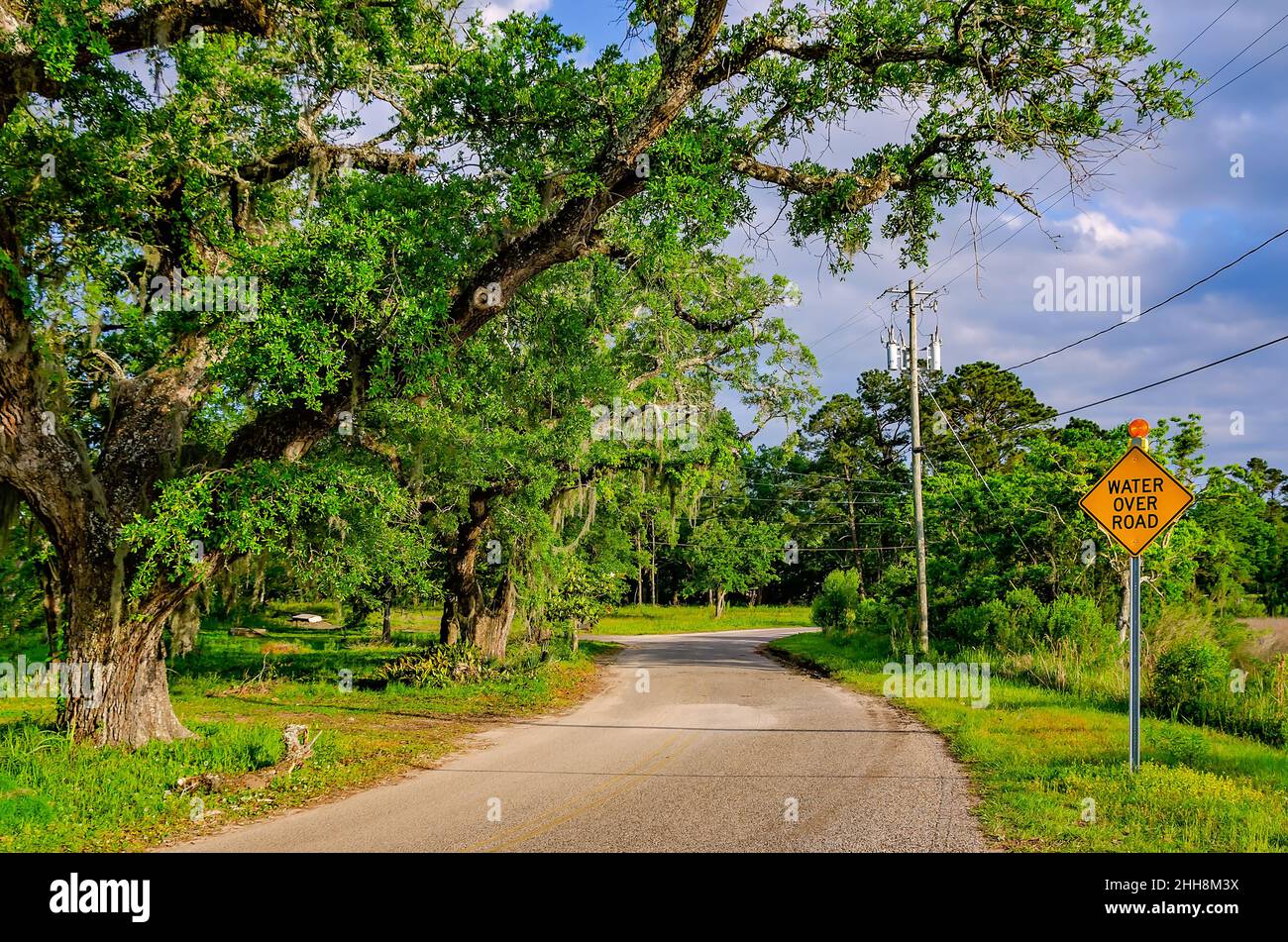 A water over road sign is pictured on Coden Belt Road, April 27, 2021, in Bayou La Batre, Alabama. Stock Photo