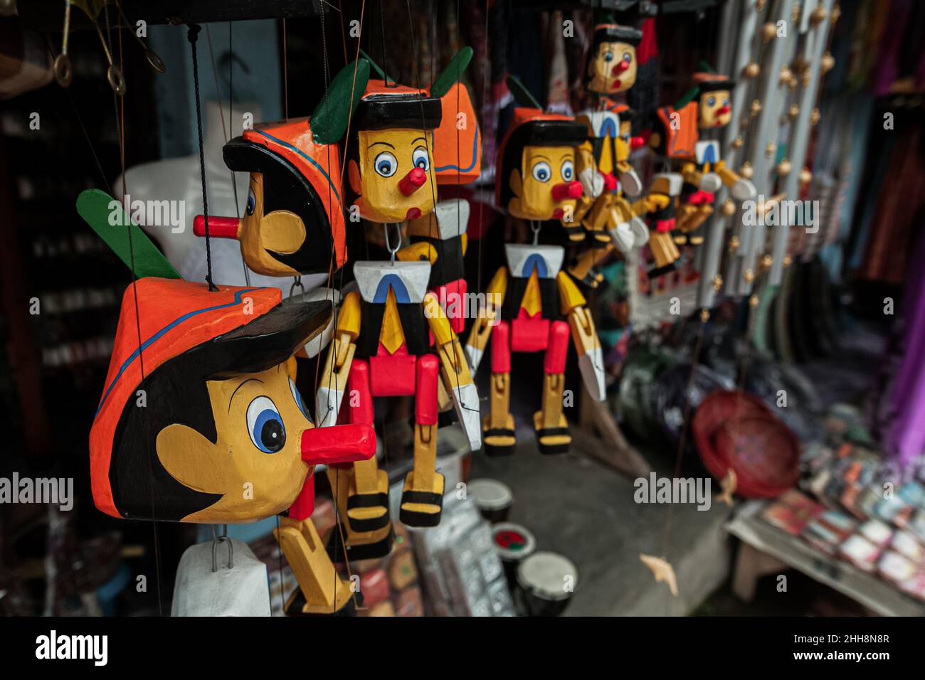Wood carved pinocchio puppets for sale, Bali, Indonesia Stock Photo