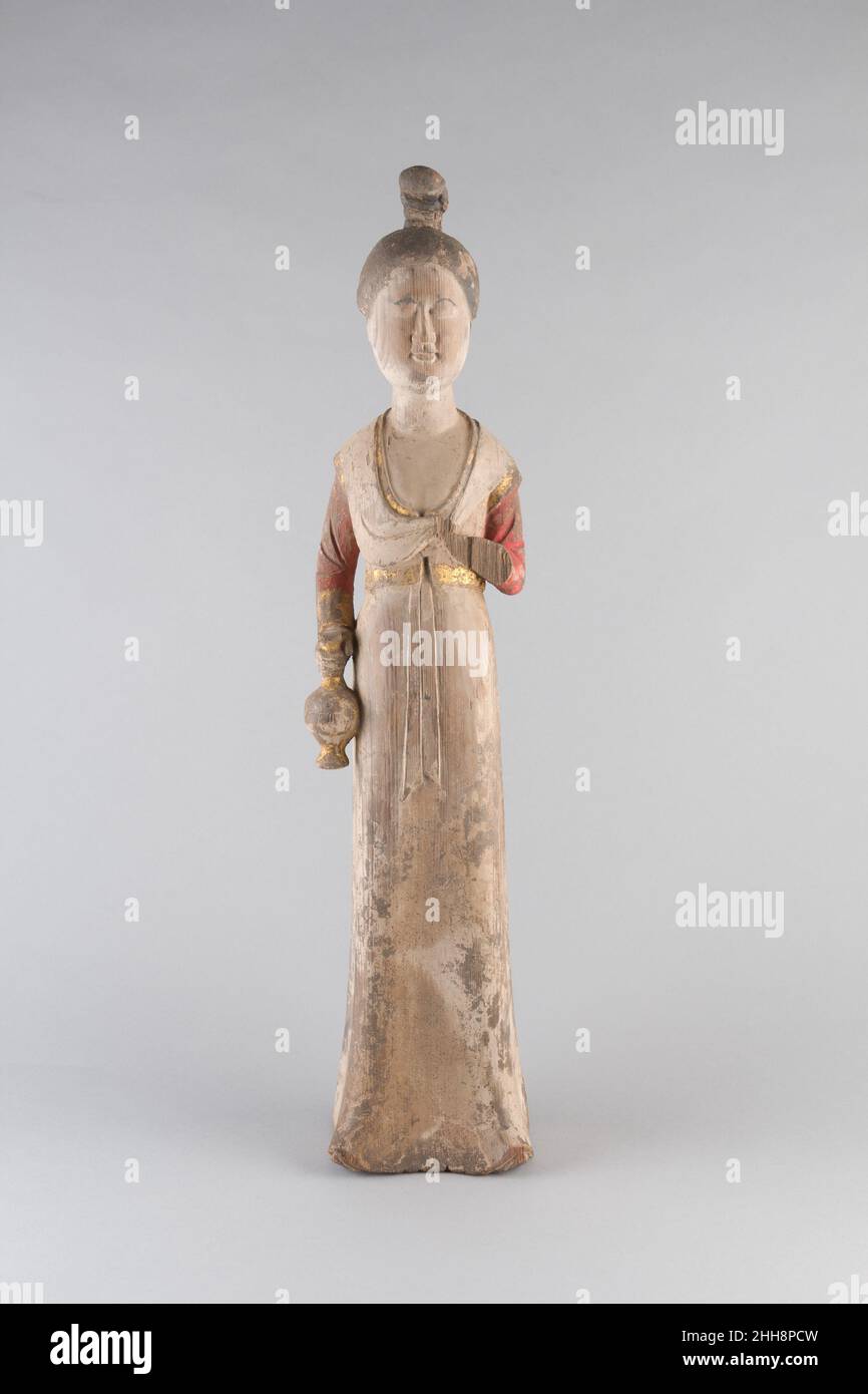 Standing Female Attendant late 7th–early 8th century China. Standing Female Attendant. China. late 7th–early 8th century. Wood with pigments. Tang dynasty (618–907). Sculpture Stock Photo