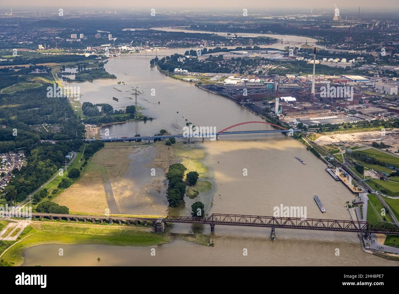 Aerial view, flood river Rhine, flood Rheinwiesen Rheinhausen and NSG Werthauser Wardt, bridge of solidarity and Hochfelder railway bridge with bridge Stock Photo