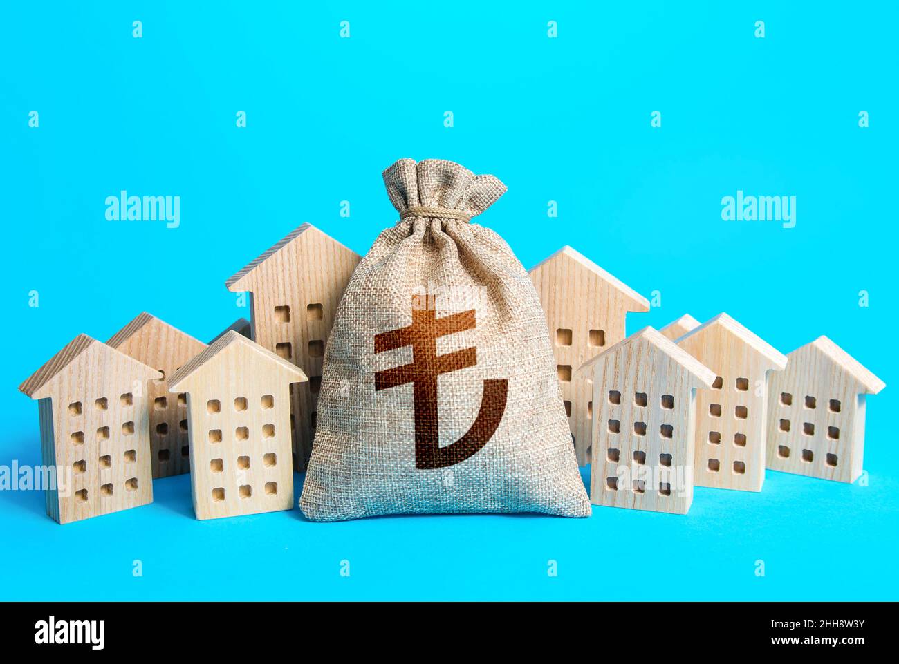 Turkish lira money bag among town houses figurines. Rich city. Rental