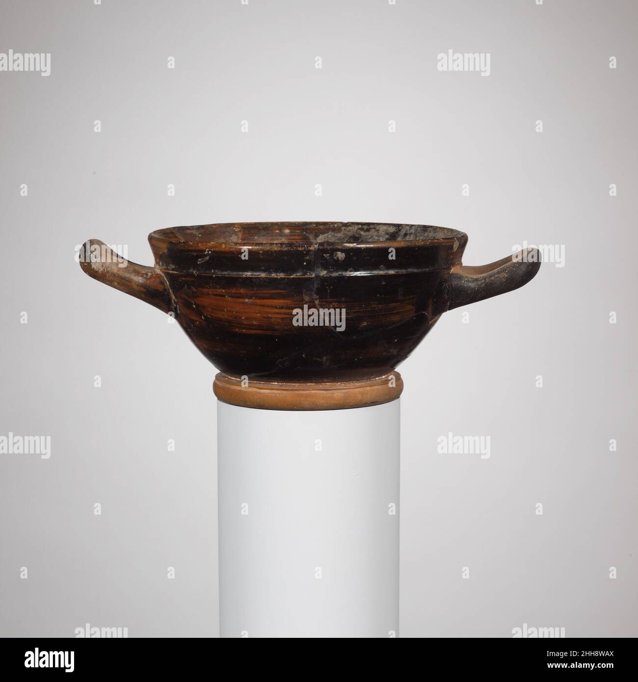 Terracotta skyphos (deep drinking cup) ca. 450–400 B.C. Greek, Attic Black glazed skyphos with reserved foot, band at rim.. Terracotta skyphos (deep drinking cup)  244747 Stock Photo