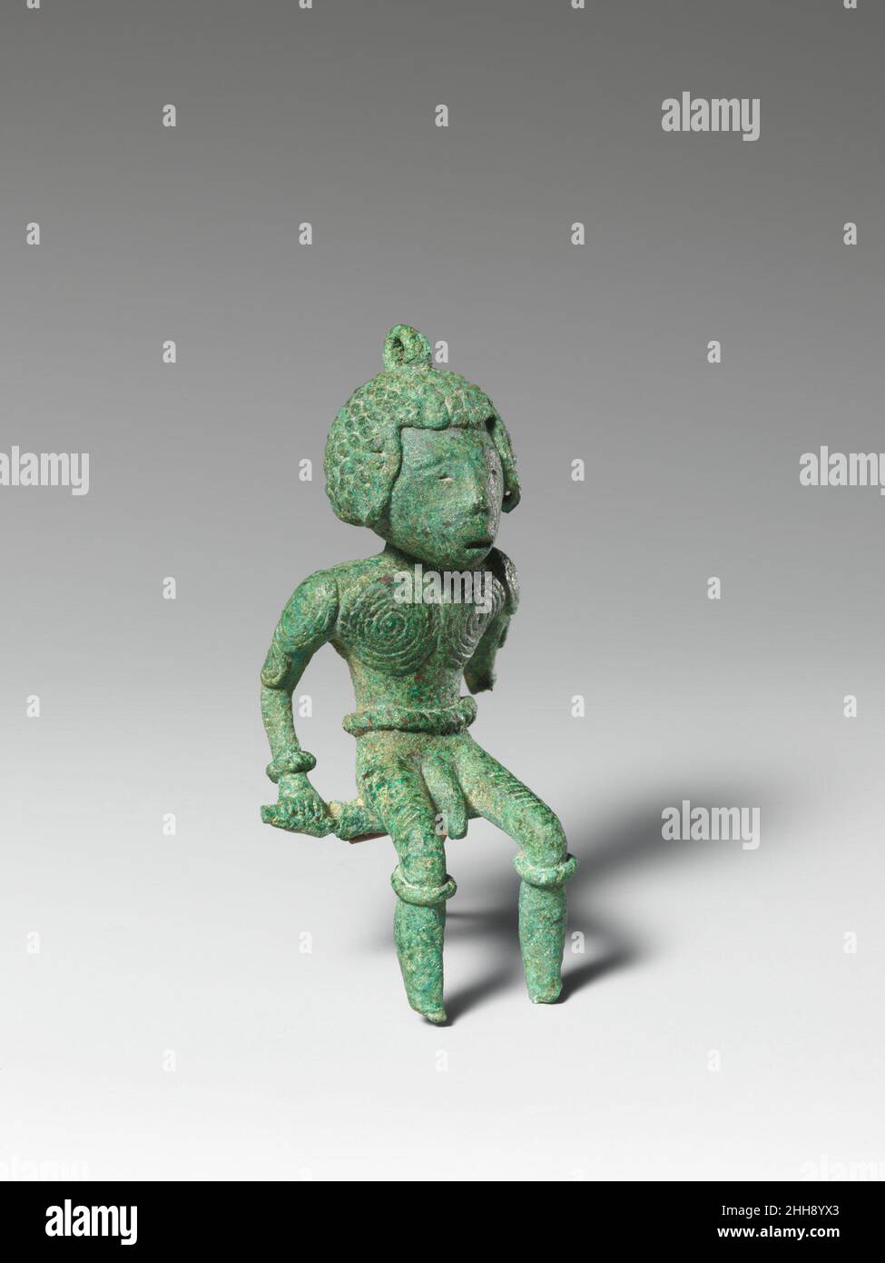 Seated Male Figure 500 B.C.– A.D. 300 Vietnam. Seated Male Figure. Vietnam. 500 B.C.– A.D. 300. Bronze. Bronze and Iron Age period, Dongson culture. Sculpture Stock Photo