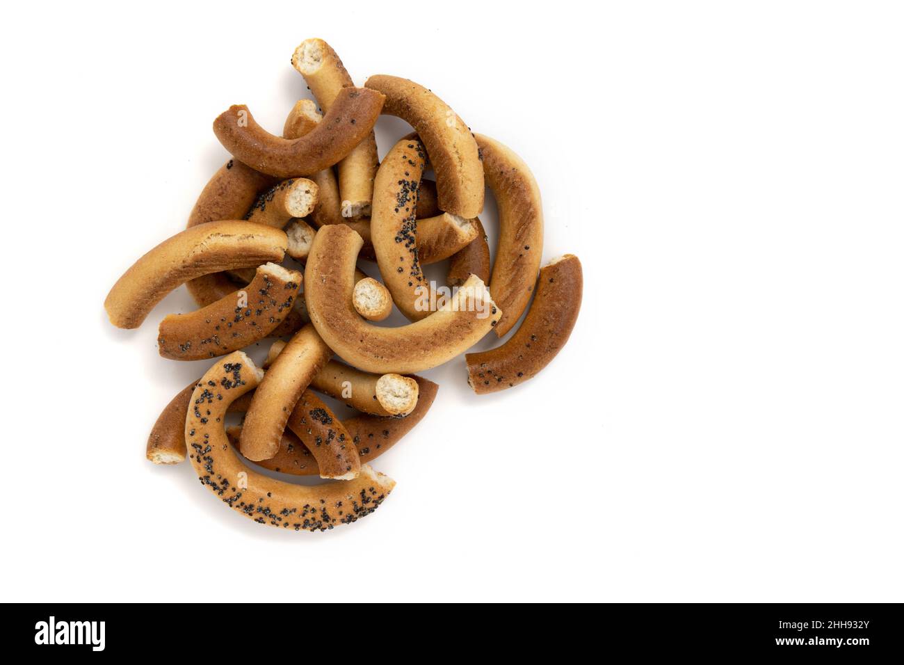 bagel with poppy seeds isolated on white background, pieces of bagels, top view, food bakery concept Stock Photo