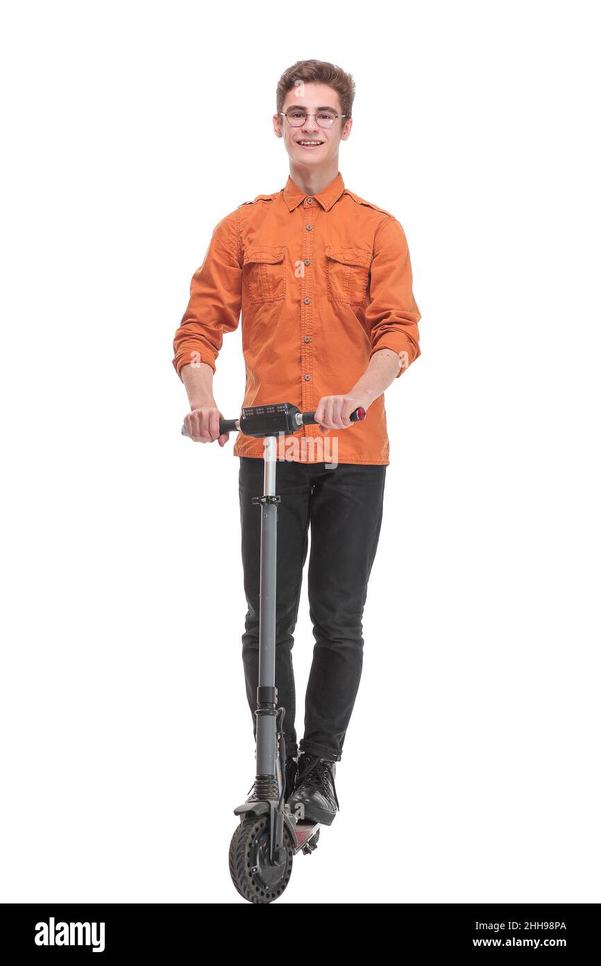 Pleasant smiling man riding a kick scooter Stock Photo