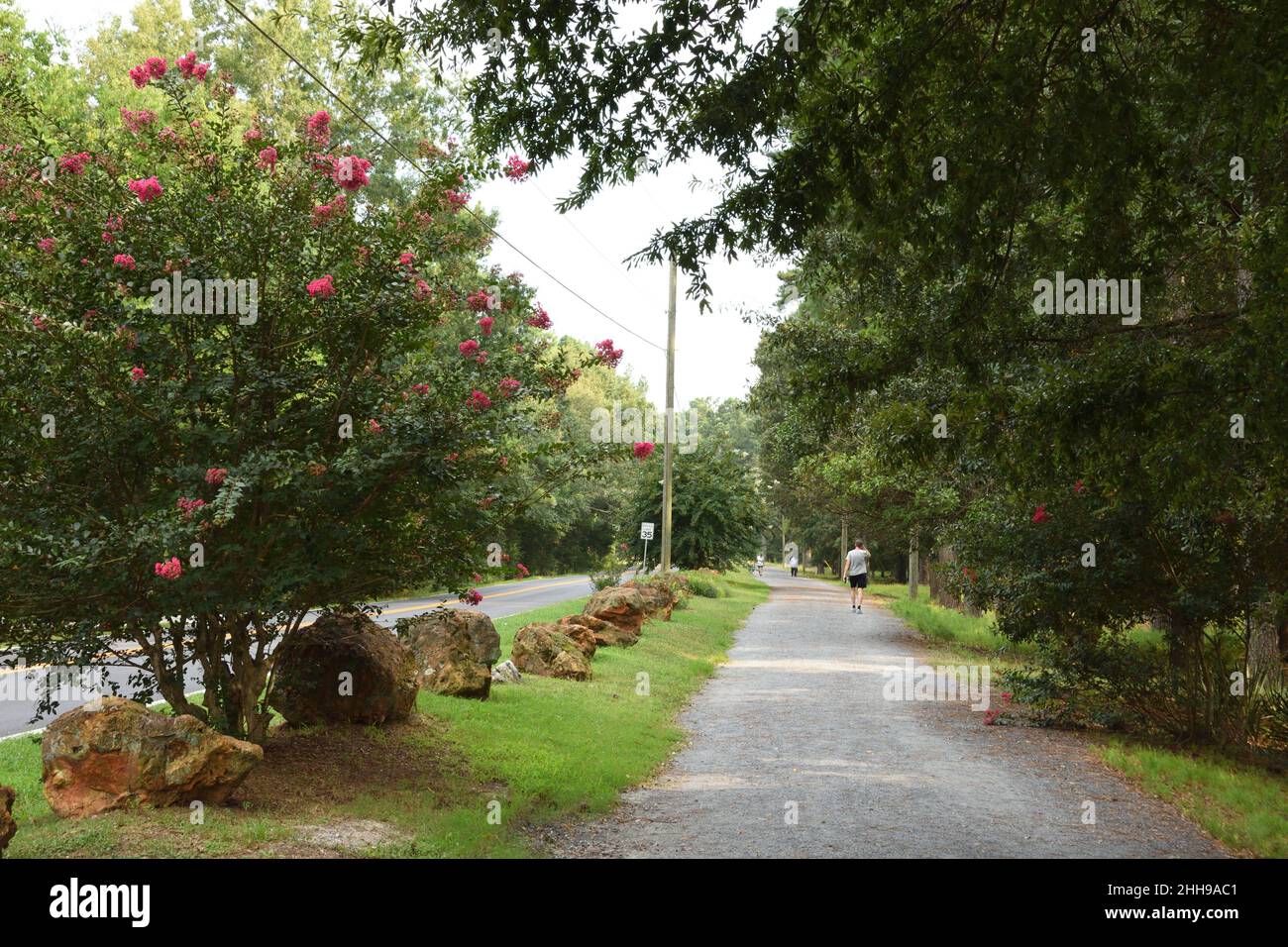 Beautiful pedestrian walkway along the road, right next to Dellinger Park, in Cartersville, GA, USA. Stock Photo