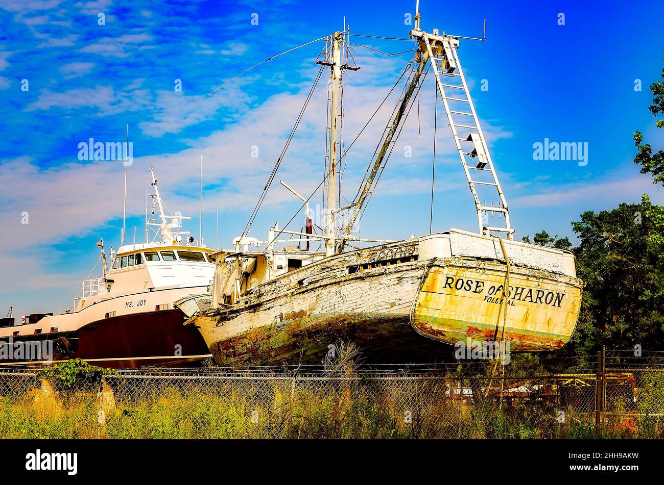 An old wooden shrimp boat is in dry dock for repair at a local shipyard, May 15, 2016, in Bayou La Batre, Alabama. Stock Photo
