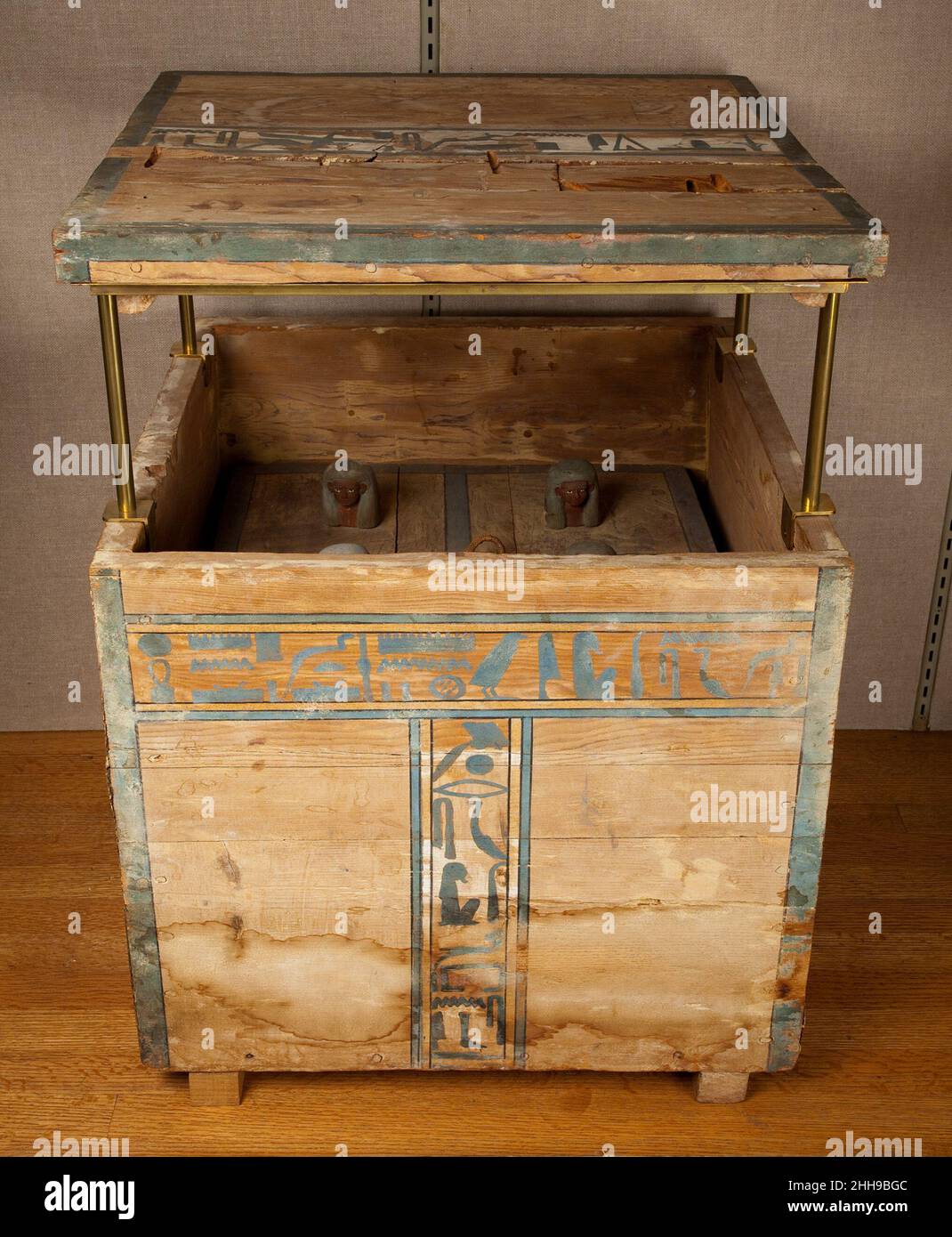 Canopic Chest of Senbi ca. 1961–1878 B.C. Middle Kingdom This canopic box was part of the burial equipment of the steward Senbi, which also included the Museum’s famous hippopotamus (nicknamed 'William' – see 17.9.1). The box is inscribed with recitations of the four sons of Horus and invocation of offerings in the name of Anubis. The inner lid is surmounted by four wooden heads representing the four sons of Horus, the guardians of the viscera.. Canopic Chest of Senbi. ca. 1961–1878 B.C.. Wood (ziziphus sp.), paint, string. Middle Kingdom. From Egypt, Middle Egypt, Meir, Tomb B3 of the nomarch Stock Photo