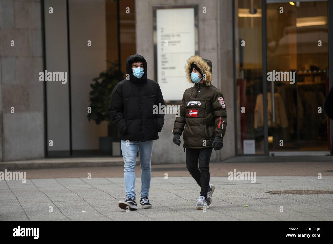People wearing face masks on the street during the winter in Budapest, Hungary Stock Photo