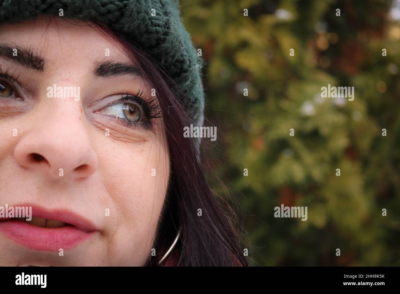 Woman with a green knit hat Stock Photo