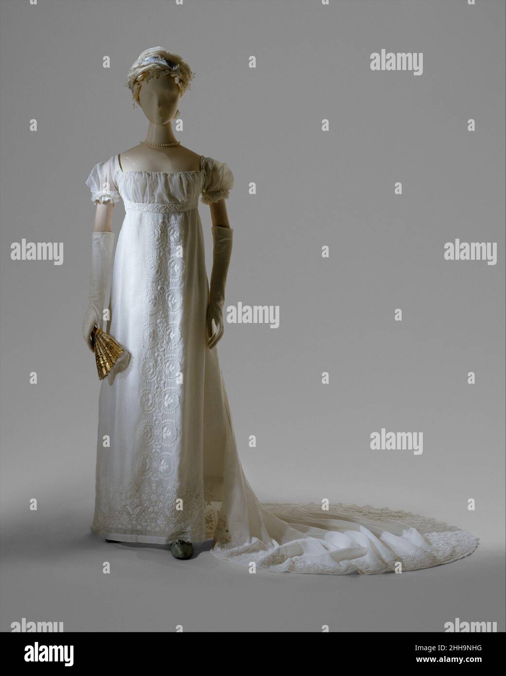 Evening dress 1804–5 French On December 24, 1803, Jerome Bonaparte (1784—1860), brother of Napoleon, wed Elizabeth Patterson (1785—1879) of Baltimore. The beautiful and fashionable young American was married in a dress of muslin and lace that, according to a contemporary, "would fit easily into a gentleman's pocket." This description evokes the sheer, narrow dresses that caused a sensation at the beginning of the nineteenth century, more because of their contrast with the elaborate hooped costumes of previous decades than for any real immodesty. Although originally thought to have been Patters Stock Photo