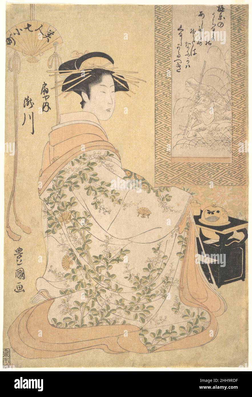 Takigawa of the Ogiya Pleasure House early 19th century Utagawa Toyokuni I Japanese Robed in a splendid floral kimono, the famous courtesan, Takigawa of the Ogiya Pleasure House, sits before a hanging scroll portrait of Ono no Komachi in her late years. Ono no Komachi, a great poet of the Heian period, was admired for her beauty. Her legendary decline into decrepit old age was taken as a paradigm for the Buddhist concept of the ephemerality of life and its pleasures. Toyokuni shows the two famous beauties—one his contemporary and the other her predecessor by many centuries—facing each other in Stock Photo