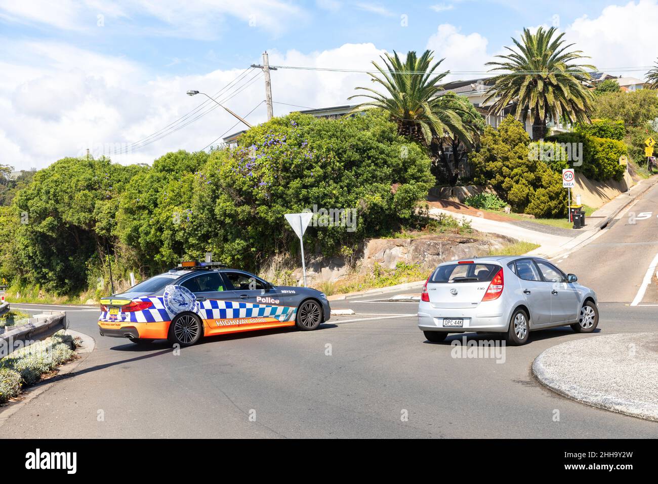 NSW Police highway patrol car blocks a road off the bilgola bends roundabout due to a serious traffic incident,Avalon,Sydney,Australia Stock Photo
