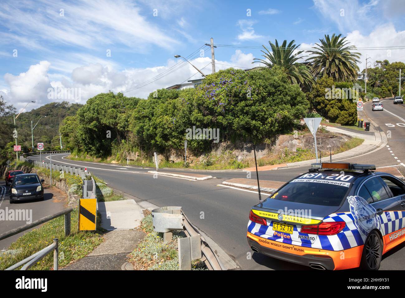 NSW Police highway patrol car blocks a road off the bilgola bends roundabout due to a serious traffic incident,Avalon,Sydney,Australia Stock Photo