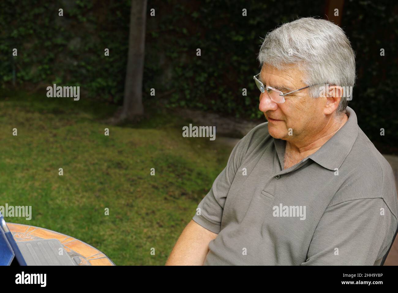 A Senior man having fun with his tablet Stock Photo