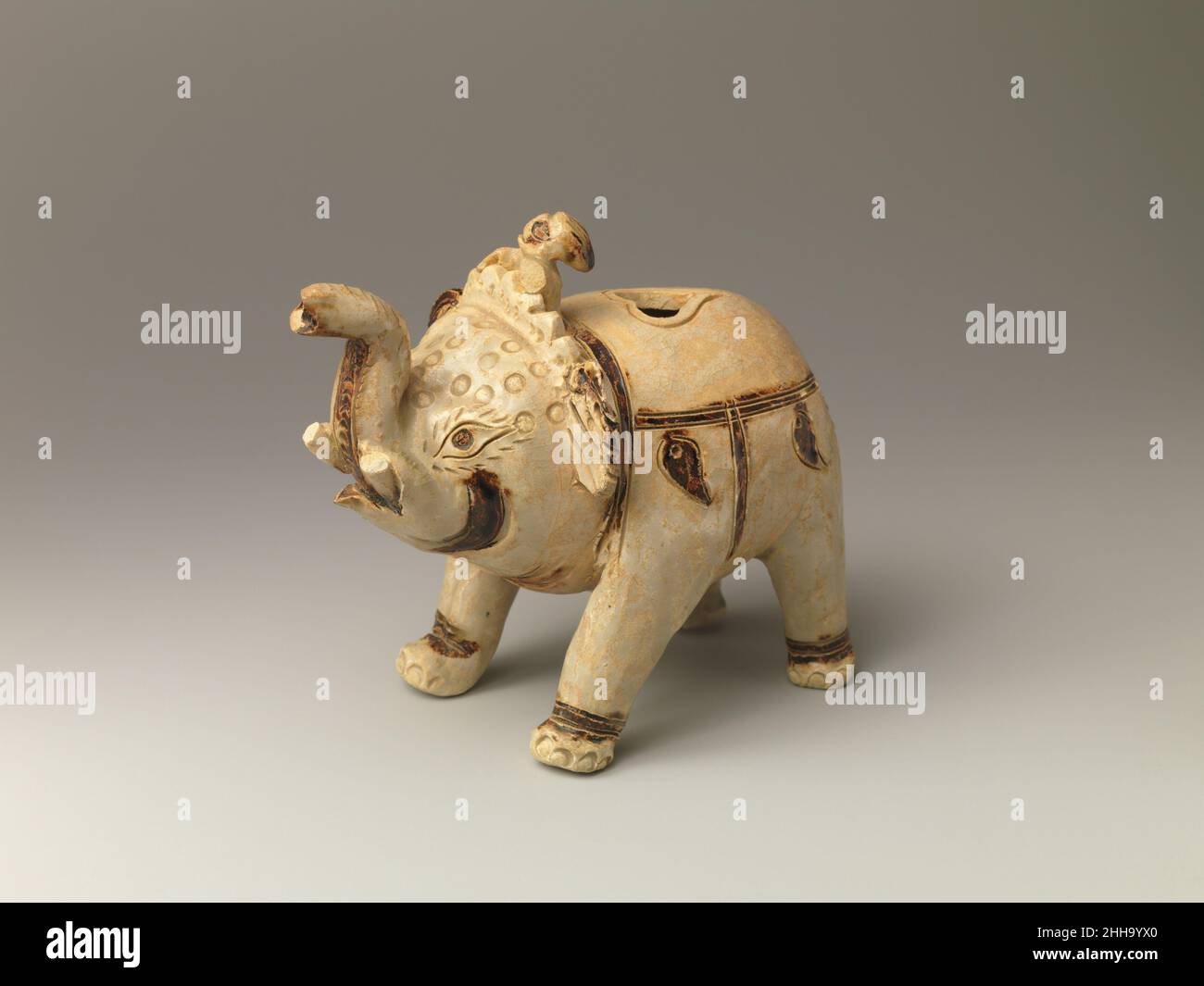 Ewer in the Form of an Elephant 11th–12th century Vietnam. Ewer in the Form of an Elephant. Vietnam. 11th–12th century. Glazed pottery with incised and inlaid decoration. Ly dynasty (1009–1225). Ceramics Stock Photo