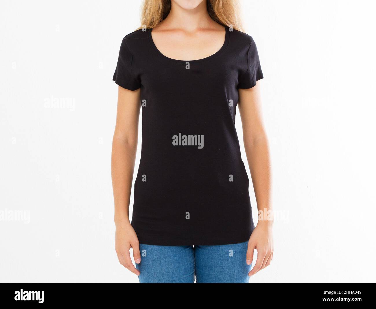 Cropped portrait of young blond woman with beautiful slim body wearing black T-shirt with copy space for your text or advertising content. Close up of Stock Photo