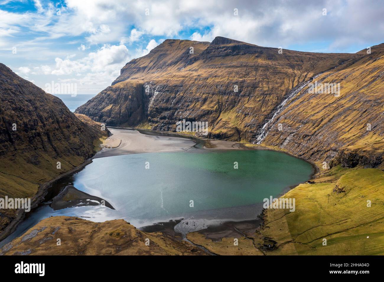 The beautiful valley of Saksun in Faroe Islands with a view to the Pollurin lake. Stock Photo