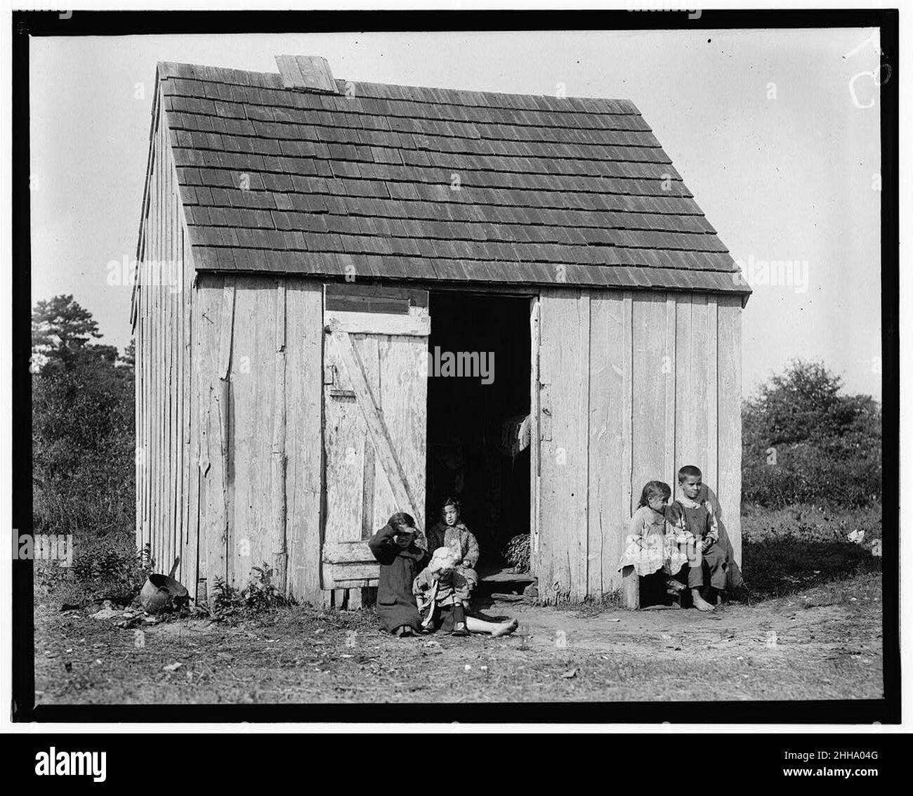 Small shack on Forsythe's Bog, occupied by De Marco family, 10 in the family living in this one room. Room is 10 ft. x 11 ft. x 5 1-2 ft. high and gable attic above. (See family picking Stock Photo