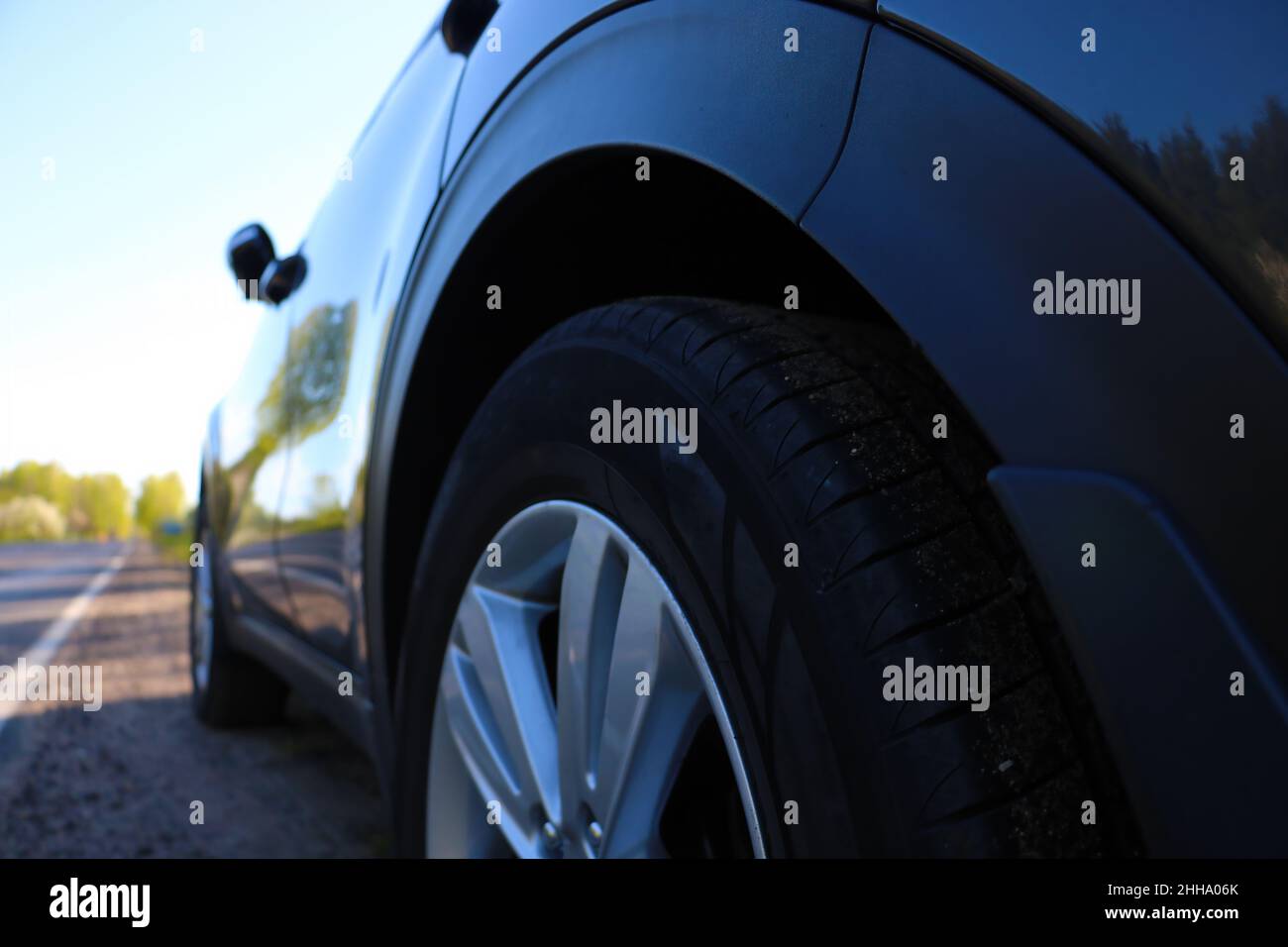 Bottom view of a parked car along the road Stock Photo