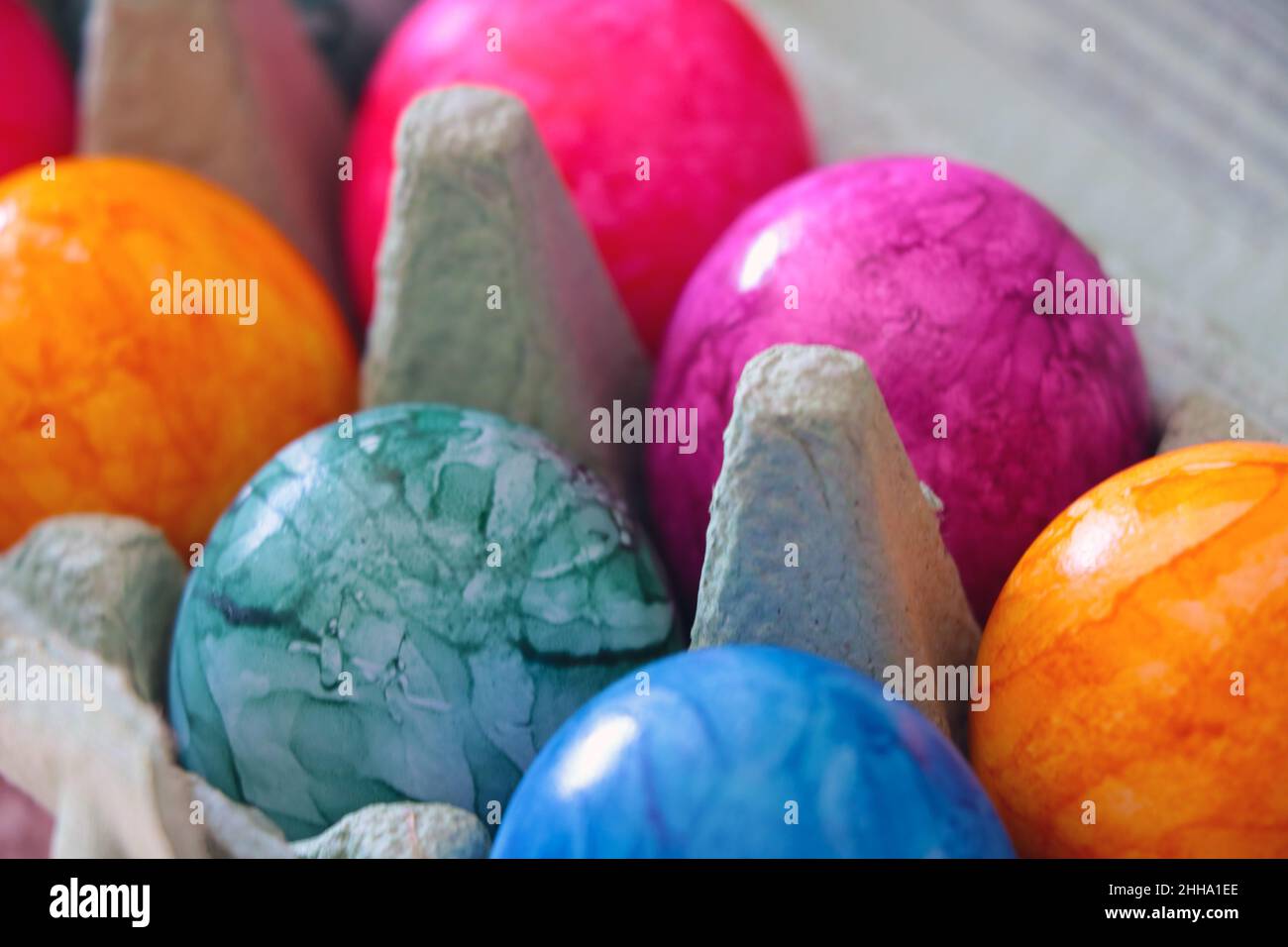 Beautiful multi-colored boiled eggs in a package. Out of focus Stock Photo