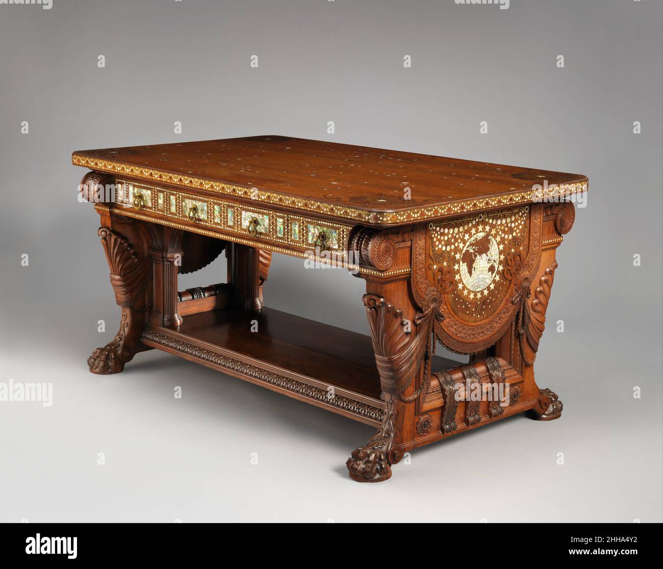 Library Table 1879–82 Herter Brothers Herter Brothers, the New York firm of the German-born brothers Gustave and Christian Herter, was arguably the leading cabinetmaking and decorating firm in the United States during the late nineteenth century. Formed at a time when wealthy American financiers and industrialists were redefining luxurious standards of living, Herter Brothers created cosmopolitan environments encompassing every aspect of interior design, including furniture and woodwork, wall and ceiling decoration, floor treatments and draperies, for some of the most visible and affluent clie Stock Photo