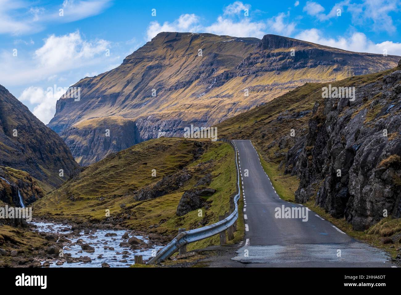 A scenic empty straight uphill road leading to Saksun, in Faroe Islands. Stock Photo