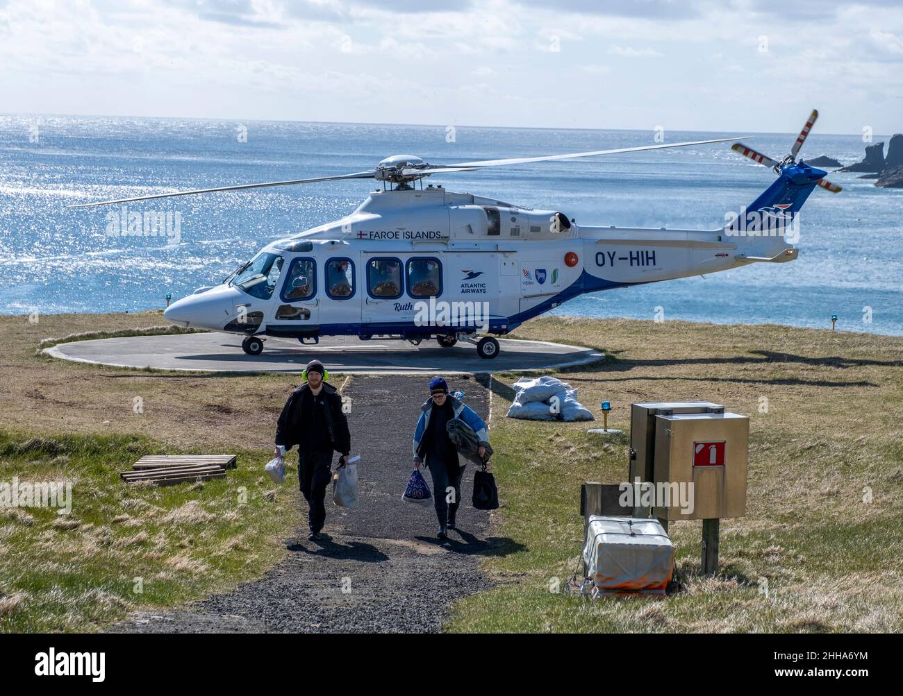 Helicopter is one of the few modes of accessing the remote island of Mykines in the Faroe Islands. Stock Photo