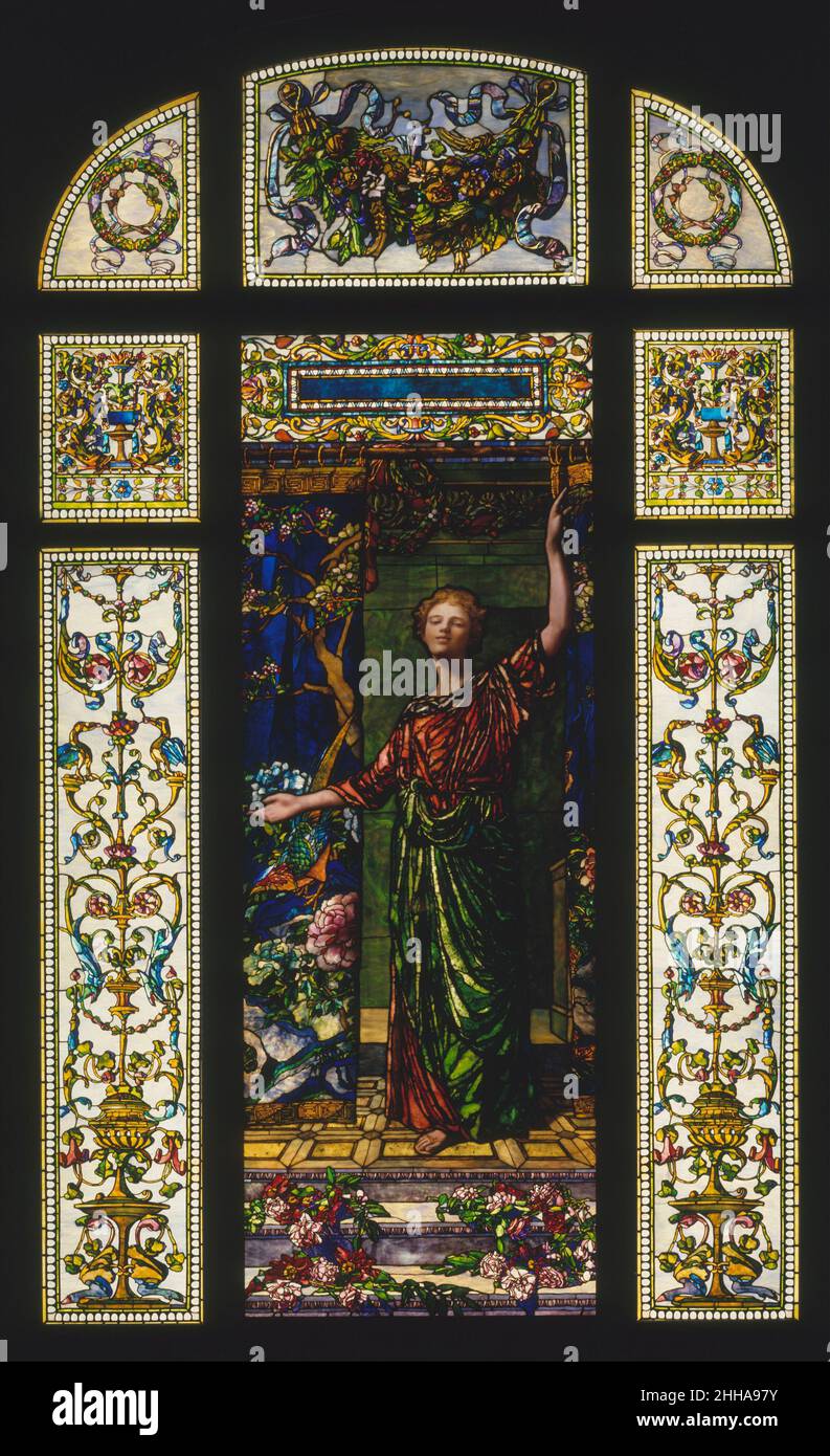 Welcome: Stained Glass Window from the Mrs. George T. Bliss House, New York 1908–9 John La Farge American John La Farge was Louis Comfort Tiffany’s closest rival in the use of opalescent, colored, and textured glass. This window, completed the year before La Farge’s death, was one of his most complex works. Commissioned in 1908 by Mrs. George T. Bliss for her house at 9 East Sixty-Eighth Street in New York City, it features a young woman in classical garb welcoming visitors while drawing back a portiere—a replication in glass of a Chinese embroidered textile originally owned by the Bliss famil Stock Photo