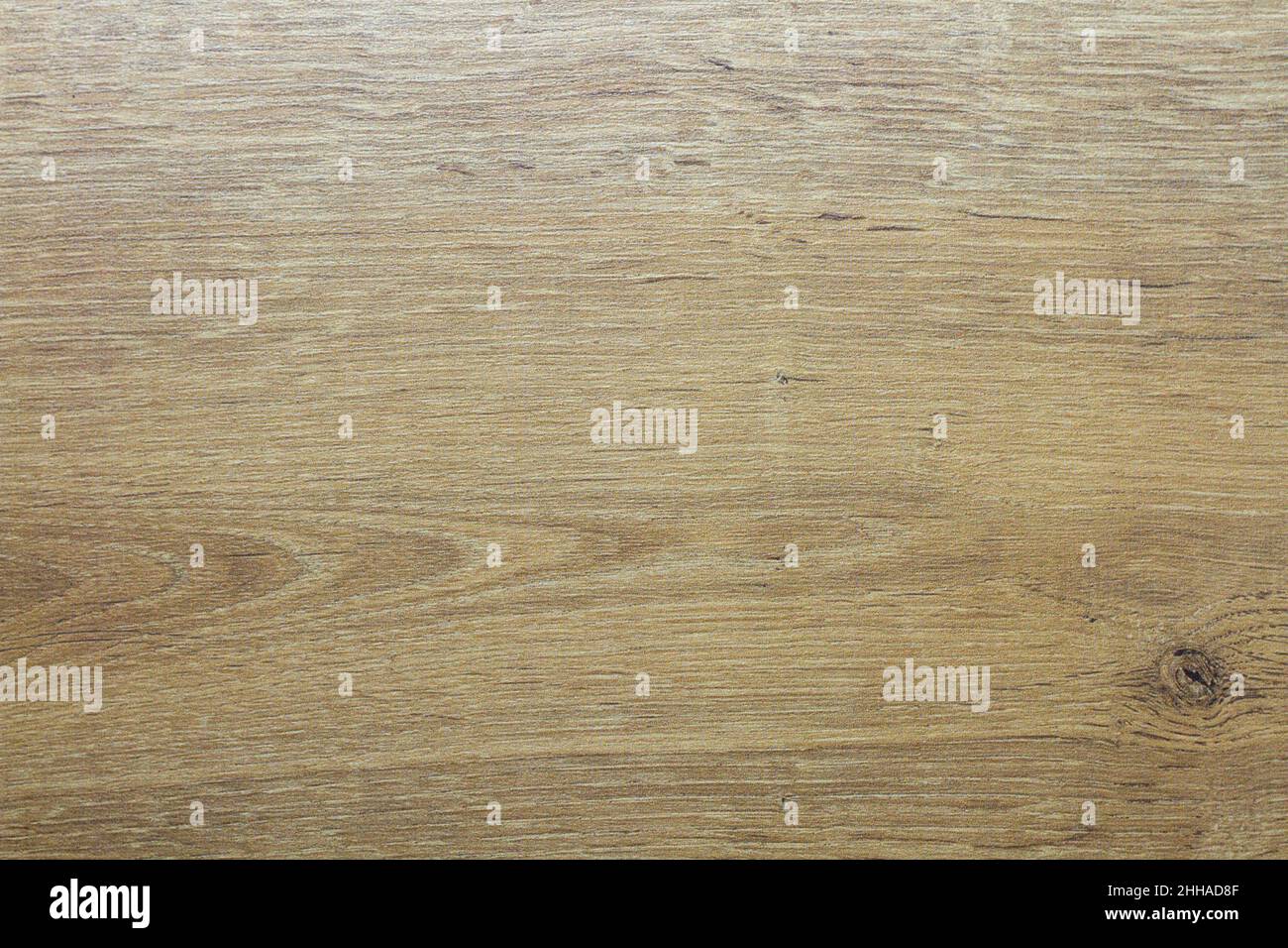 Wood texture. Wooden board close up. The cracks are deep. Laminate flooring. Tree rings in a cut