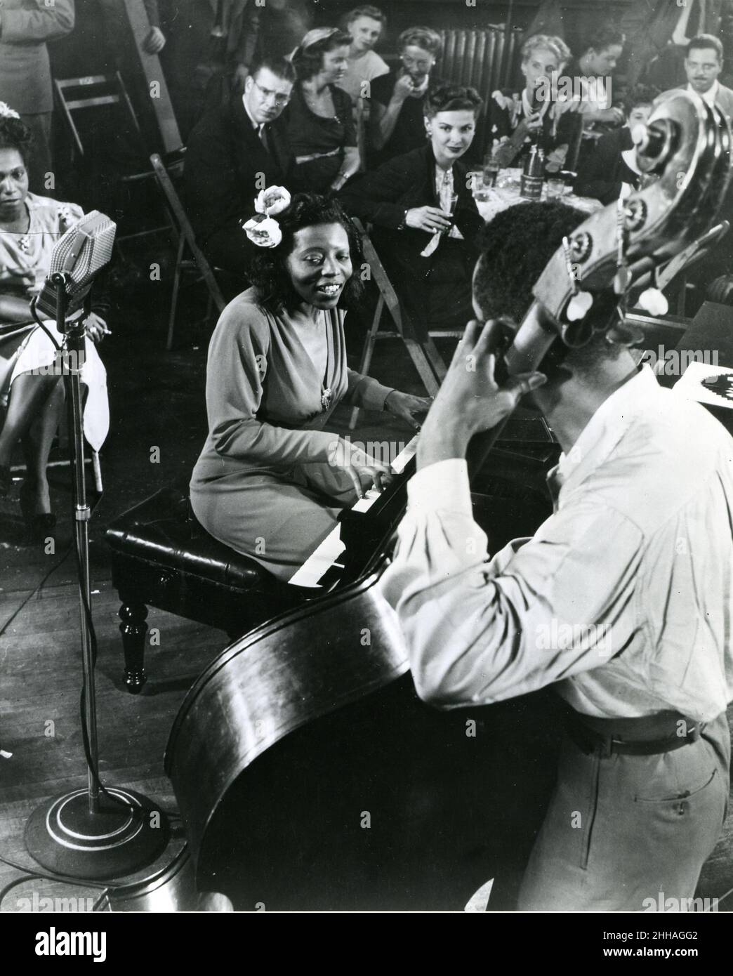 New York, circa 1945 - Mary Lou Williams plays a boogie-woogie selection at Cafe Society downtown, an integrated club. Miss Williams arranges for the Duke Ellington band. Stock Photo