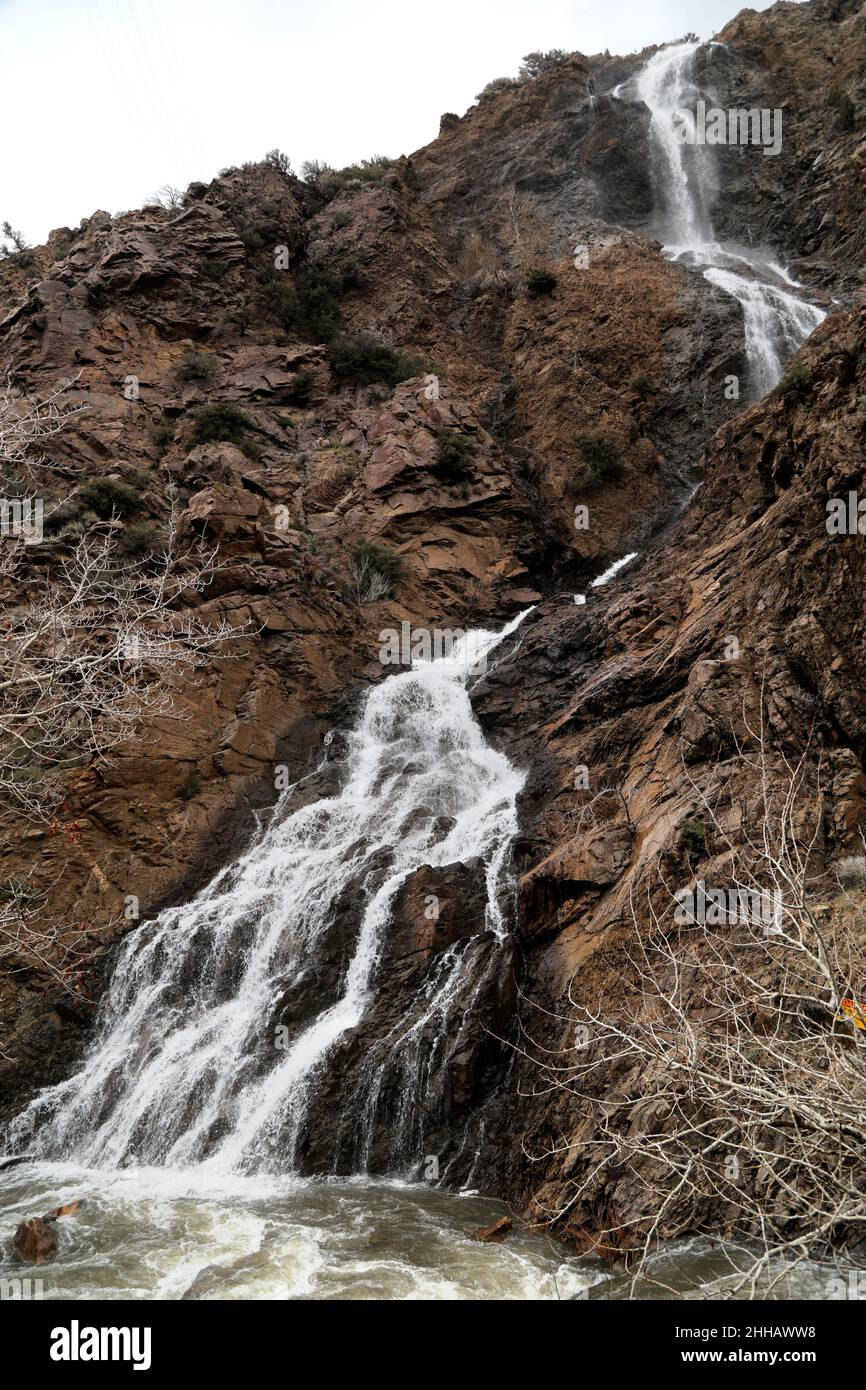 Melted snow water drains down the waterfall in the Wasatch Mountains in Ogden Utah. Stock Photo