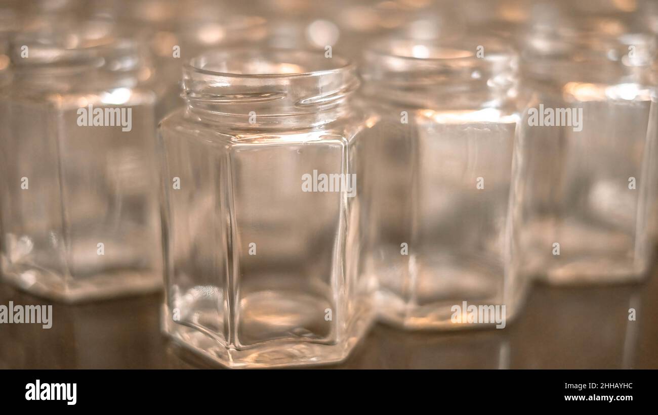 Realistic empty glass jars with gold metal lids. Stock Photo