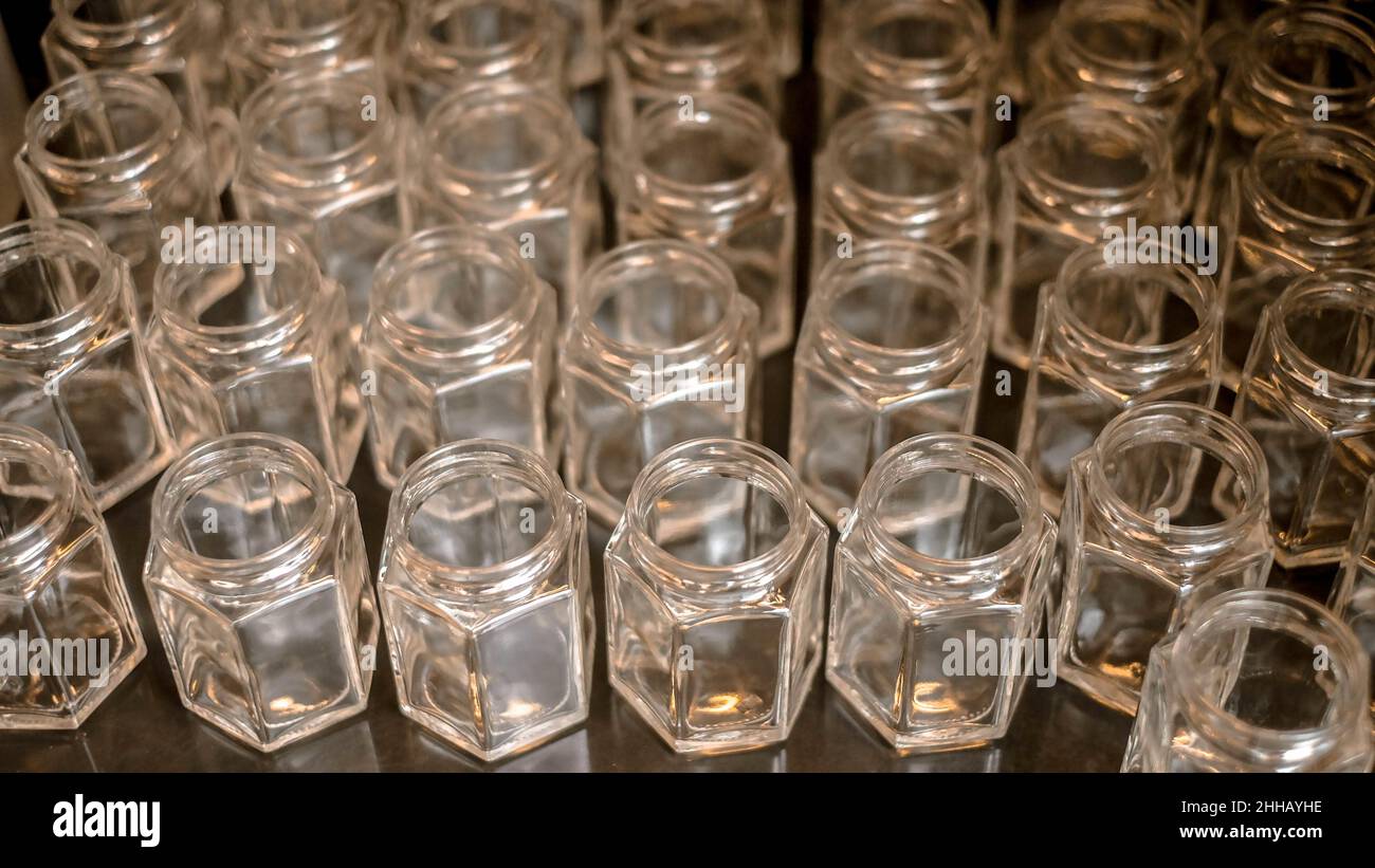 Realistic empty glass jars with gold metal lids. Stock Photo
